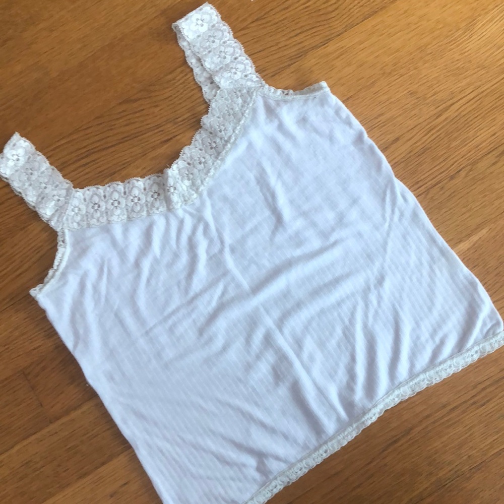 Light blue tank top with lace designing.